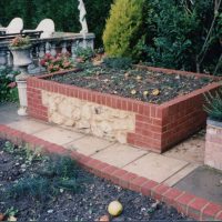 Brick and ragstone planter